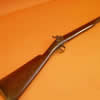 Irish percussion sporting gun by Trulock of Dublin. Overall length 47 inches and with a 30 inch twist barrel marked Dublin on the top flat, it is full stocked with brass mounts, back-lock marked TRULOCK, it is with its steel ram-rod, crisp working action, some staining to the barrel otherwise sound.